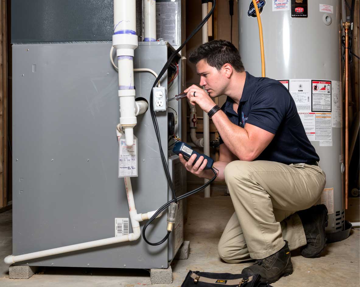 HVAC technician performing a furnace tune-up in Tucson
